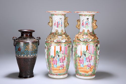 A PAIR OF CANTONESE FAMILLE ROSE VASES, each typically deco
