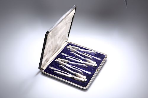 A CASED SET OF FOUR SILVER-PLATED NUTCRACKERS AND PICKS, EA
