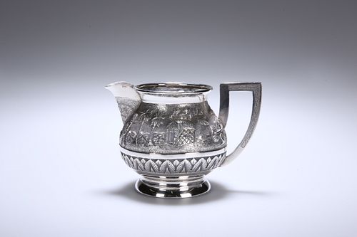 AN INDIAN SILVER CREAM JUG, c. 1900, of spherical form, the
