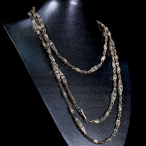 A VICTORIAN GUARD CHAIN, of pierced decorative links on Alb