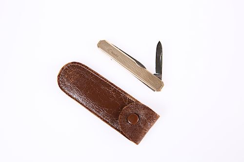 A 9 CARAT GOLD FOLDING KNIFE, the hallmarked gold with engi