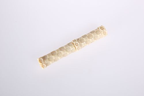 A CARVED BONE NEEDLE CASE, PROBABLY JAPANESE, c. 1900, with