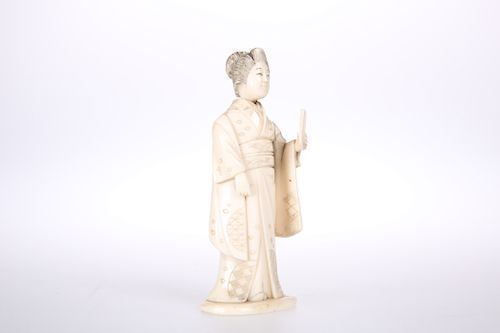 A JAPANESE CARVED IVORY FIGURAL NEEDLE CASE, MEIJI PERIOD, 