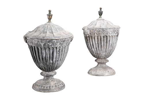 A PAIR OF GEORGE III LEAD URNS, C.1800, the fluted bodies w