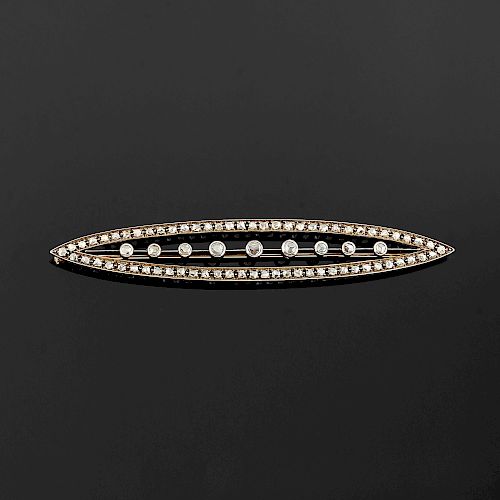 A gold, silver and diamond brooch