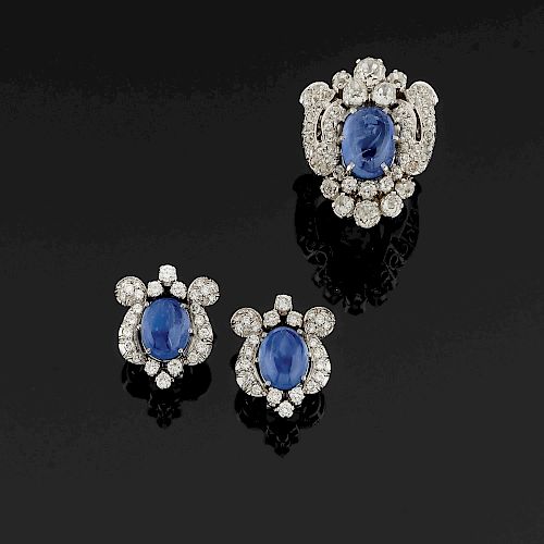 A 18K white gold, diamond and sapphire ring and earclips