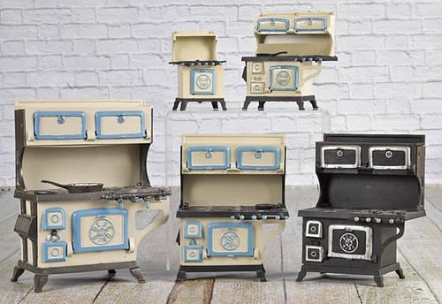 Five Grey Iron cast iron Blue Bird toy stoves,