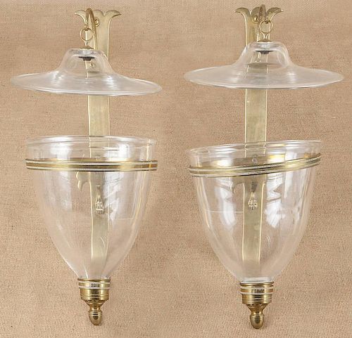 Pair of brass wall sconces with colorless glass s