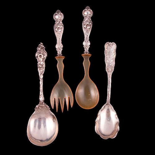 Four sterling serving spoons.
