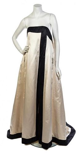 * A Ted Lapidus Cream and Black Strapless Gown, No size.