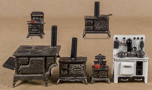 Six cast iron toy stoves, to include a Grey Iron