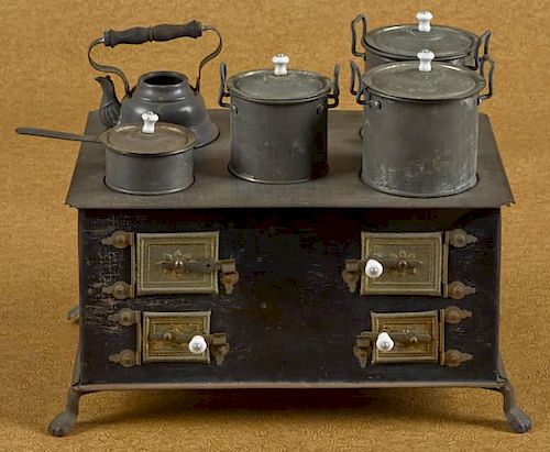 Tin toy stove, probably German, 5 1/2'' h., 10'' w.