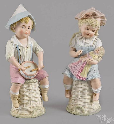 Pair of German bisque figures of a boy and girl,