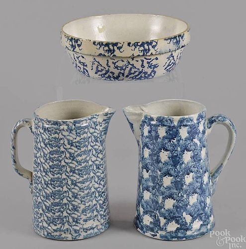 Two blue sponge pitchers, 19th c., together with