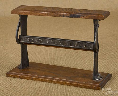 Oak and iron advertising rack, inscribed Chew Sp