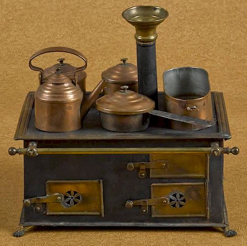 Brass and tin toy stove with copper cooking acces