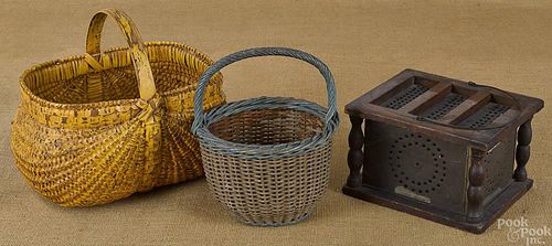 Two painted baskets, together with a footwarmer.