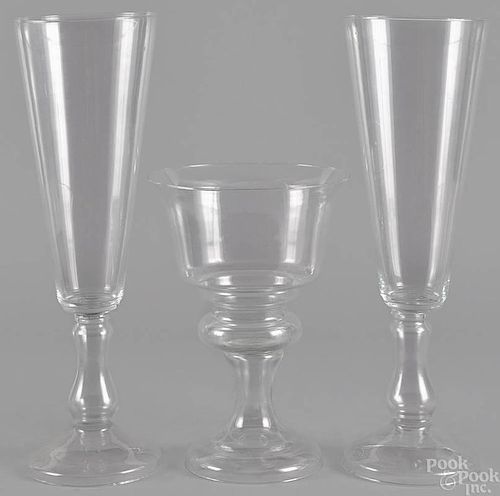 Three French colorless glass candy containers, on