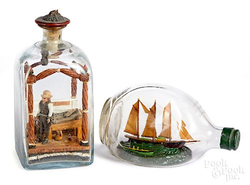Two carved dioramas in bottles