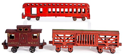 Three cast iron train cars - Kenton. etc.