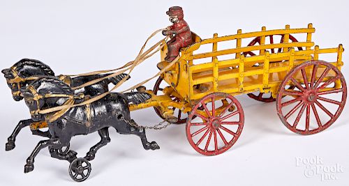 Hubley cast iron horse drawn stake back wagon