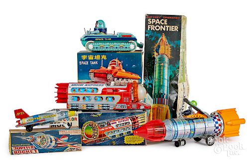 Four tin space toys, in the original boxes