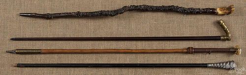 Four walking sticks, ca. 1900, to include horn, a