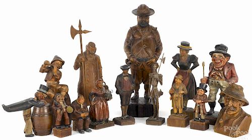 Fourteen Continental carved wooden figures, 19th/