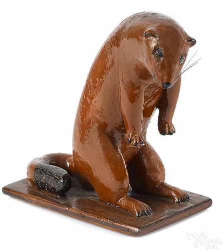 Carved and painted figure of an otter, mid 20th c