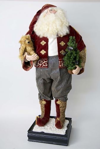 Santa Claus Figure Holding Teddy Bear and Christmas Tree