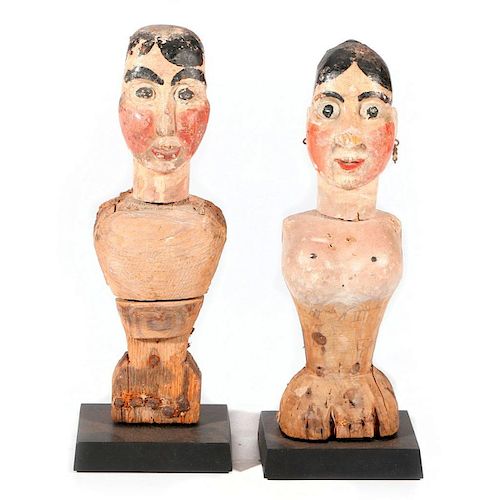 Couple of carved folk art partial figures