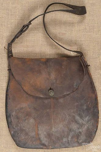 Tooled leather bag, early 19th c., with a horse b