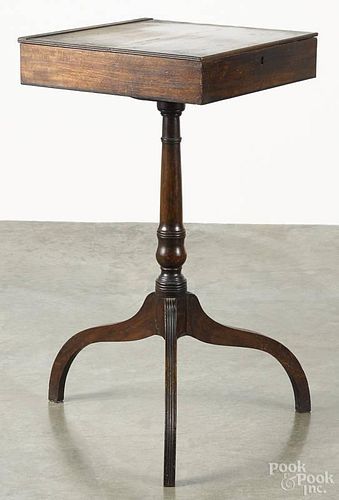 Regency mahogany stand, ca. 1820, with a lift lid compartment top, 30 3/4'' h., 16 1/2'' w., 15 3/4'' d.