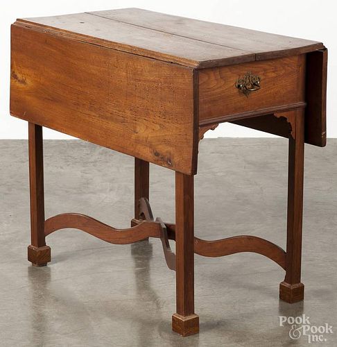 Chippendale walnut Pembroke table, late 18th c., with an arched stretcher, 29'' h., 32 1/2'' w.