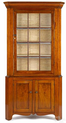 Federal cherry two-part corner cupboard, early 19