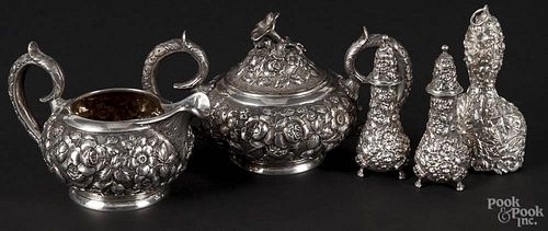 Five pieces of repoussé sterling silver holloware, to include a Stieff covered sugar