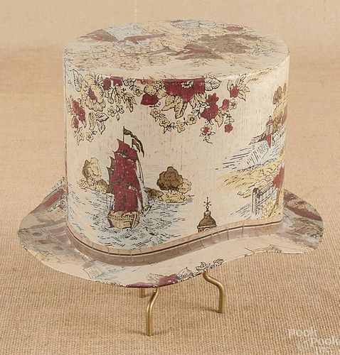 Wallpaper covered hat box, dated 1889, with Phi