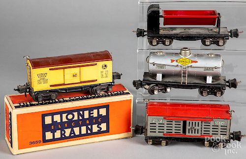 Four Lionel freight train cars