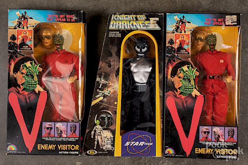 Three boxed action figures