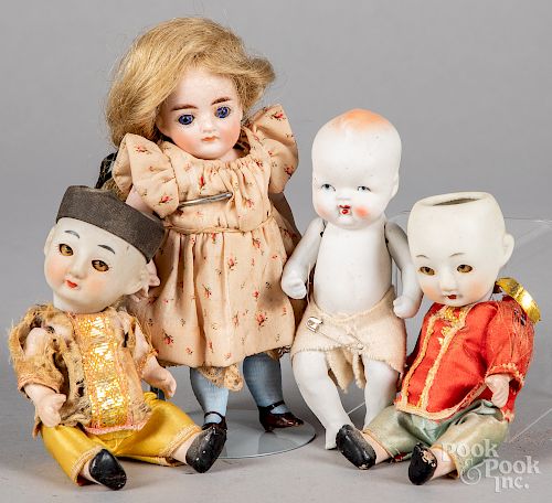 Four small bisque dolls, two all bisque