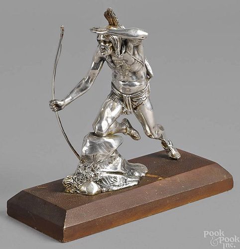 Silver plated figure of an Indian with a bow and