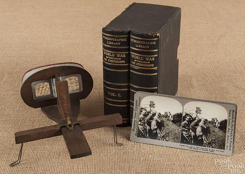 Hand held stereoscope, together with a set of Wor