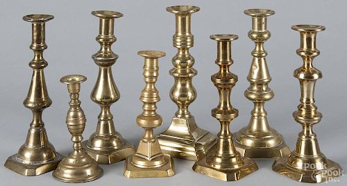 Eight unmatched English brass candlesticks, 19th c., of similar forms, largest - 10 1/4'' h.