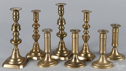 Two pairs of English brass candlesticks, 8 3/4'' h. and 7 7/8'' h.