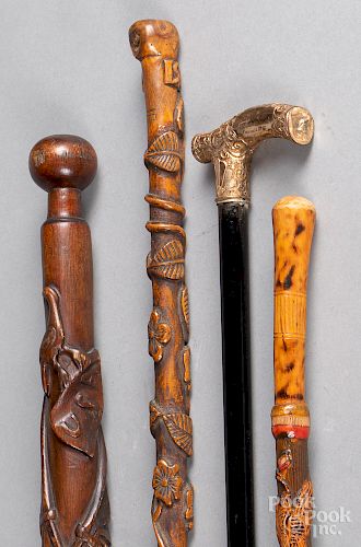 Three folk art carved canes, etc.