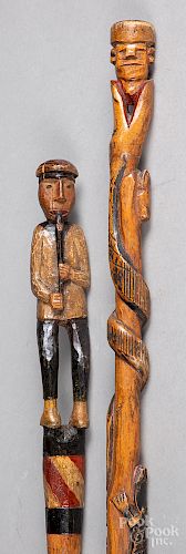 Two carved and painted canes