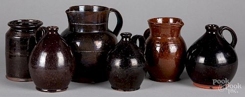 Three redware ovoid jugs, etc.