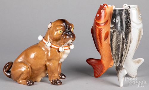 Porcelain pug, together with a three fish vase