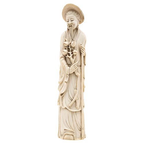 CHINESE ELDER HOLDING PEACHES OF IMMORTALITY. CHINA, 20TH CENTURY. Carved in ivory. Signed on base.