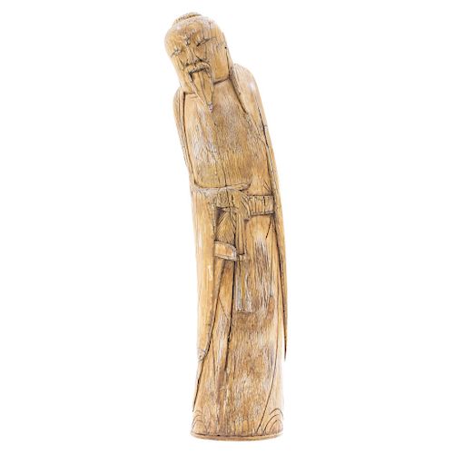 WISE MAN. CHINA, EARLY 20TH CENTURY. Carved in ivory with inked detailing.